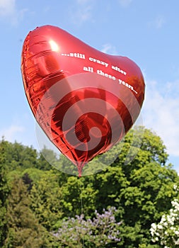 A red balloon with nice background Ã¢â¬Â¦still crazy after all these yearsÃ¢â¬Â¦ photo